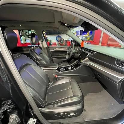 Clean black leather cabin after interior detailing.