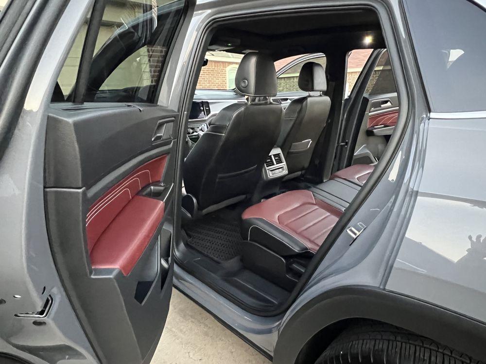 Detailed vehicle interior with clean seats and door jambs.