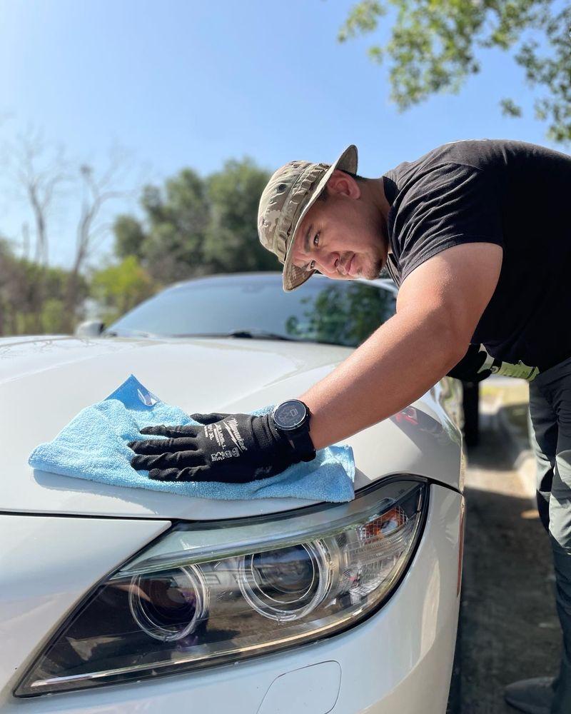 Sandoval Detailing Co team member detailing a vehicle.